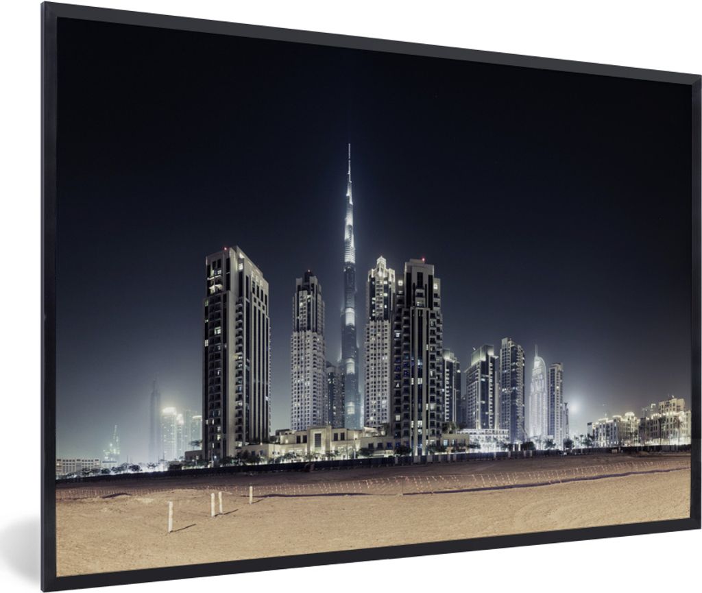 MuchoWow MuchoWow Gerahmtes Poster Der Burj Khalifa erhellt den Himmel über Dubai mit anderen Wolkenkratzern 60x40 cm - Poster mit zchwarzem B...