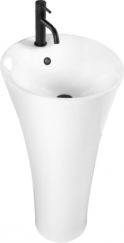 A white pedestal sink with a black faucet.