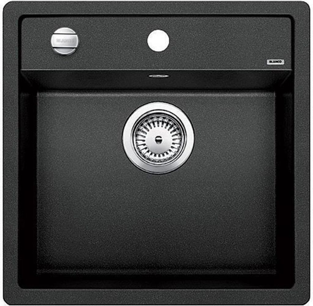 A top-down view of a black kitchen sink with a silver drain.