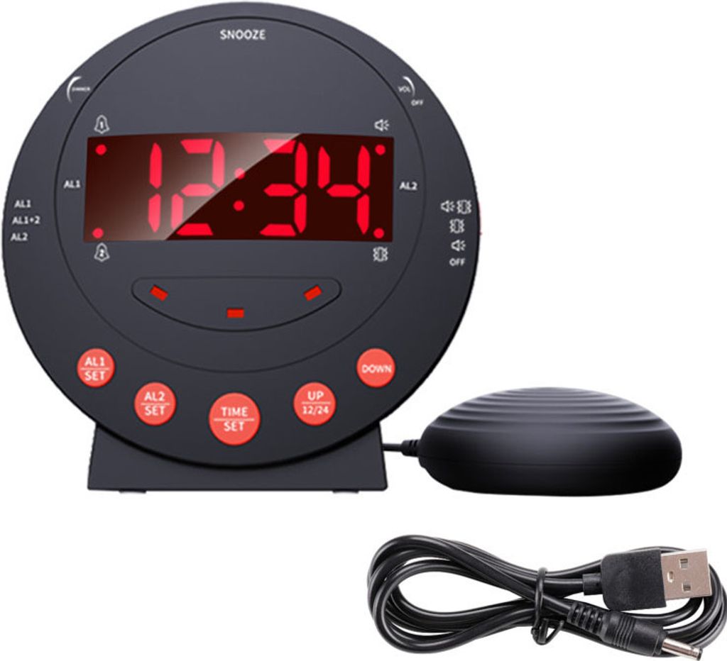 A black digital alarm clock with red LED display and a vibrating puck accessory is shown.