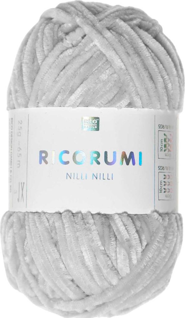 A ball of light gray yarn with a label wrapped around it.
