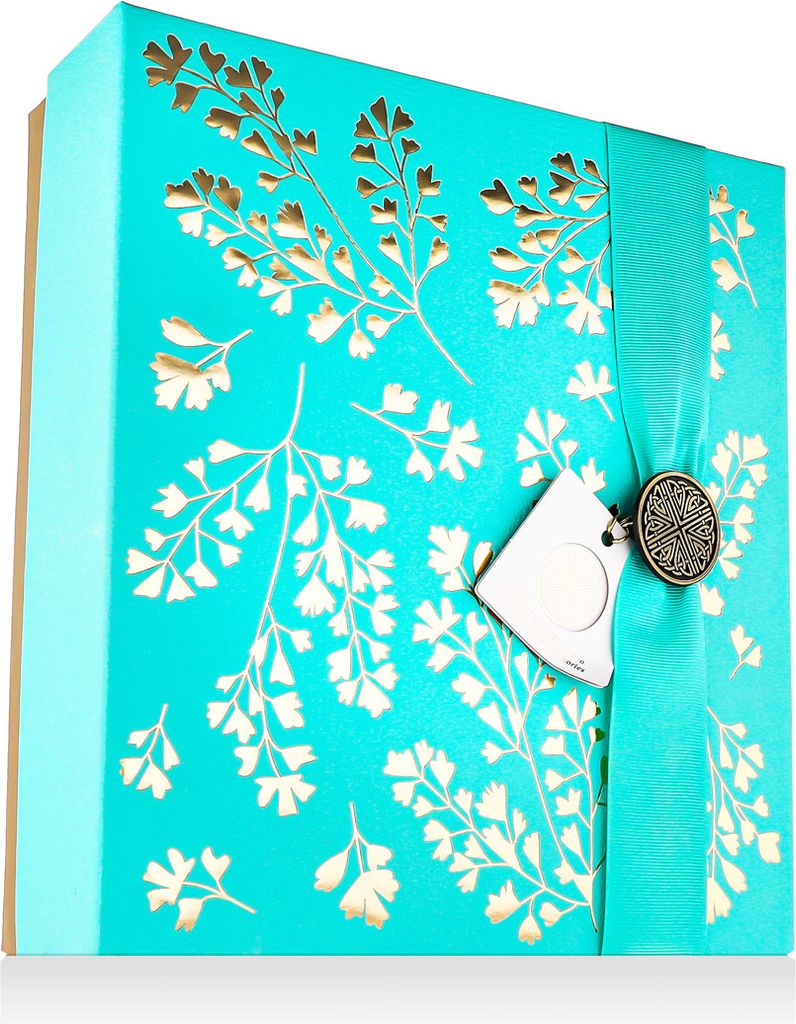 A teal gift box with gold floral patterns and a ribbon.