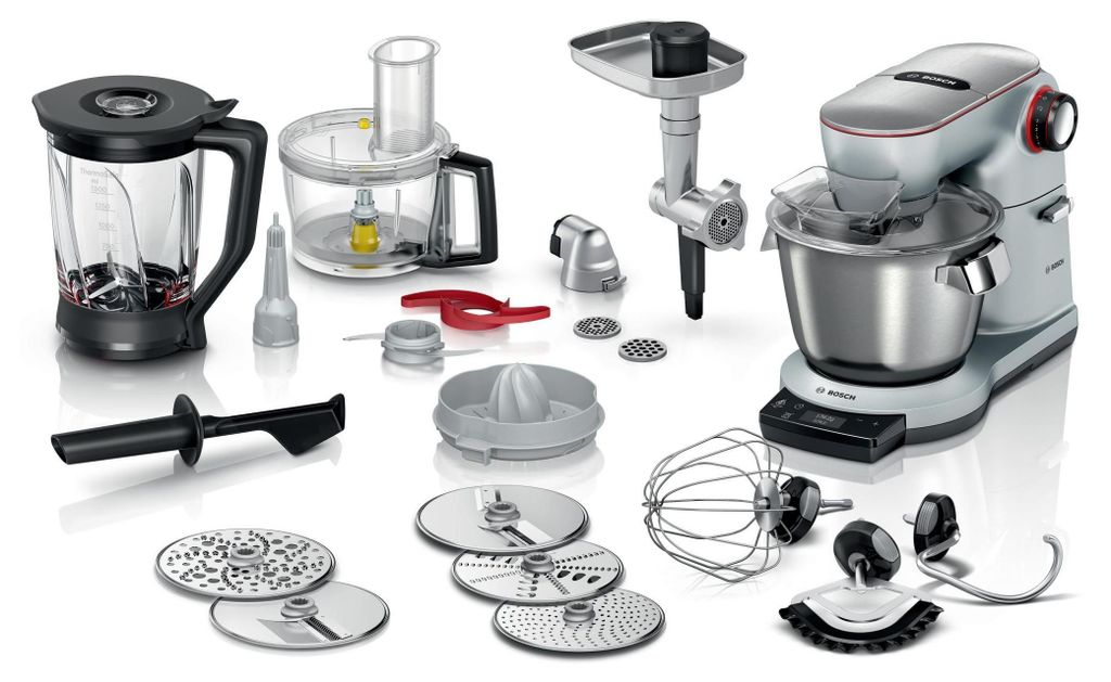A collection of kitchen appliance attachments and a stand mixer are displayed on a white background.