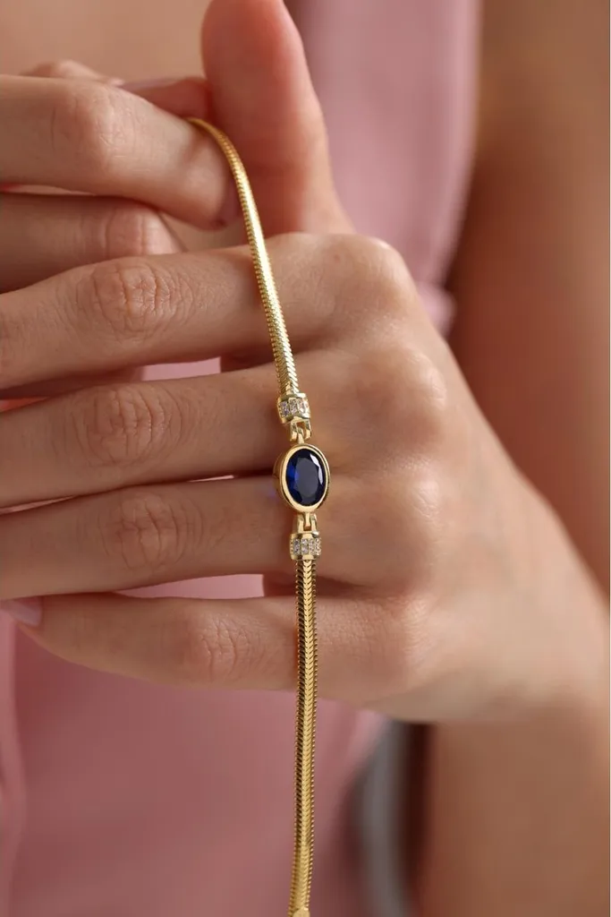 Collier maille épi en argent doré et pendentif pierre bleue marine