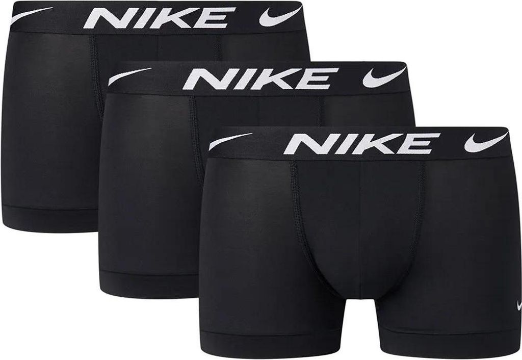 Three black Nike boxer briefs are arranged in a staggered formation against a white background.