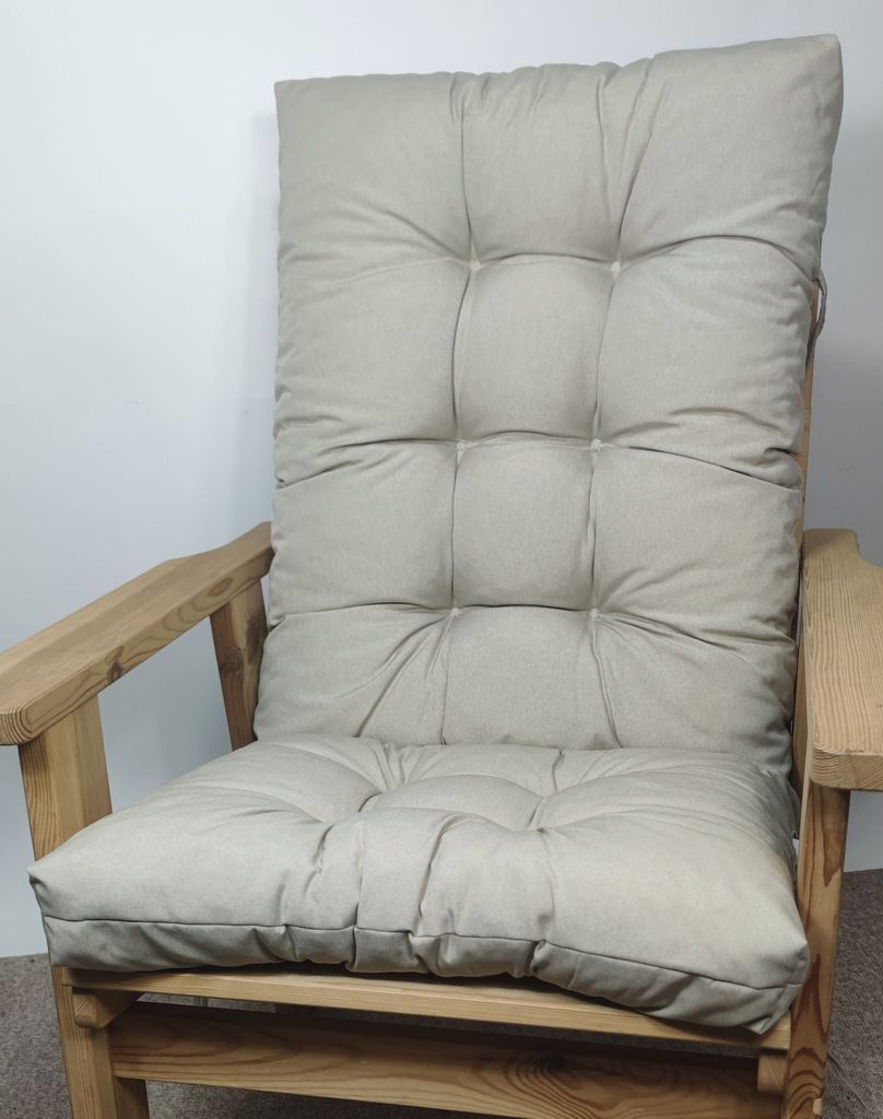 A close-up shot of a beige cushion on a wooden chair.