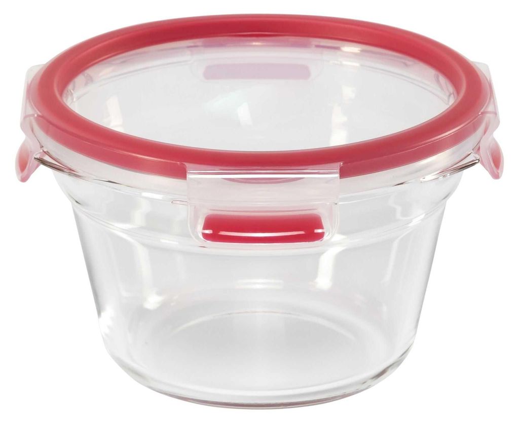 A clear, studio shot of a round glass food storage container with a red lid and locking mechanism.