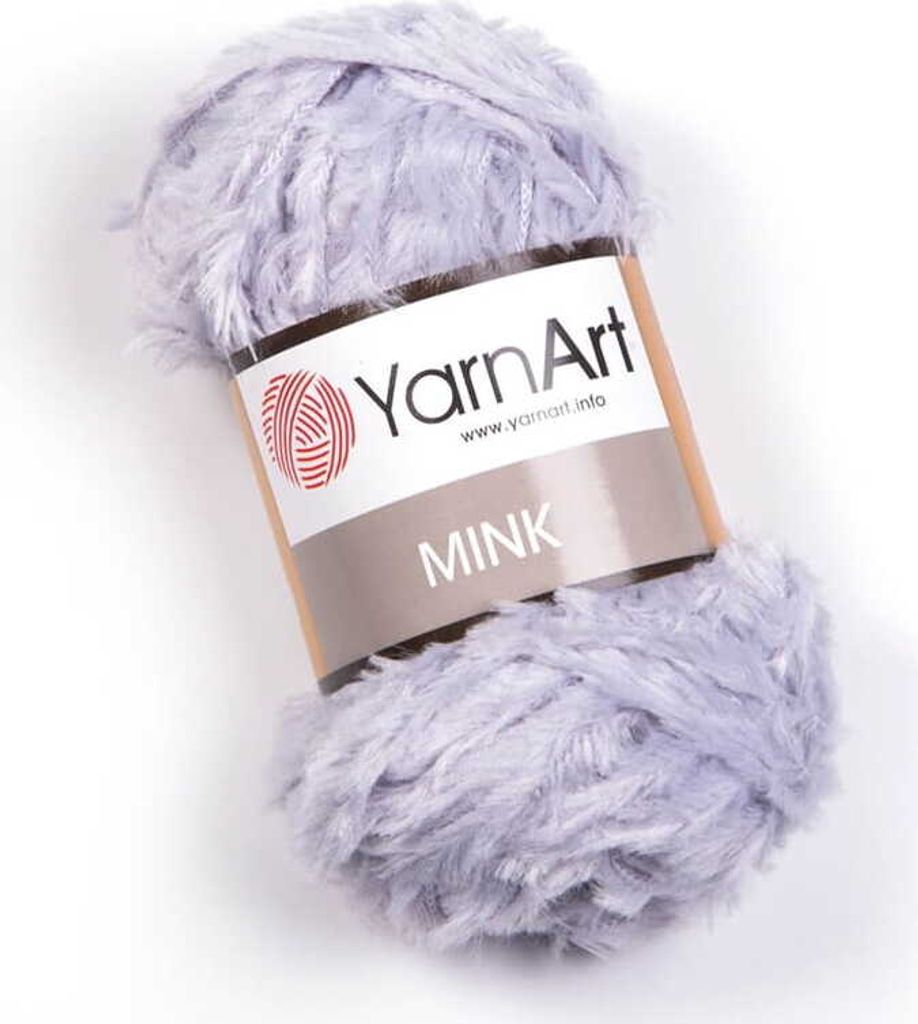 A ball of fluffy, light purple yarn with a label.