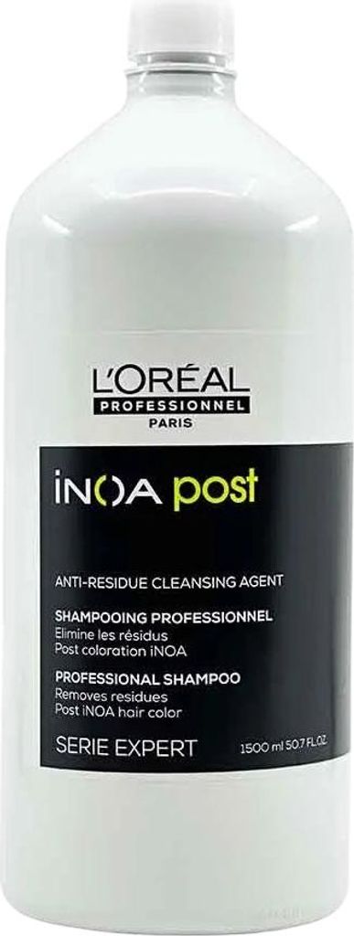 A white bottle of L'Oréal INOA Post-Shampoo is shown against a white background.