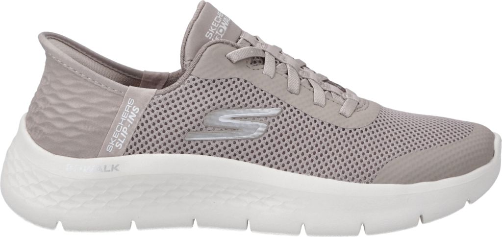 A side view of a beige Skechers slip-on shoe.