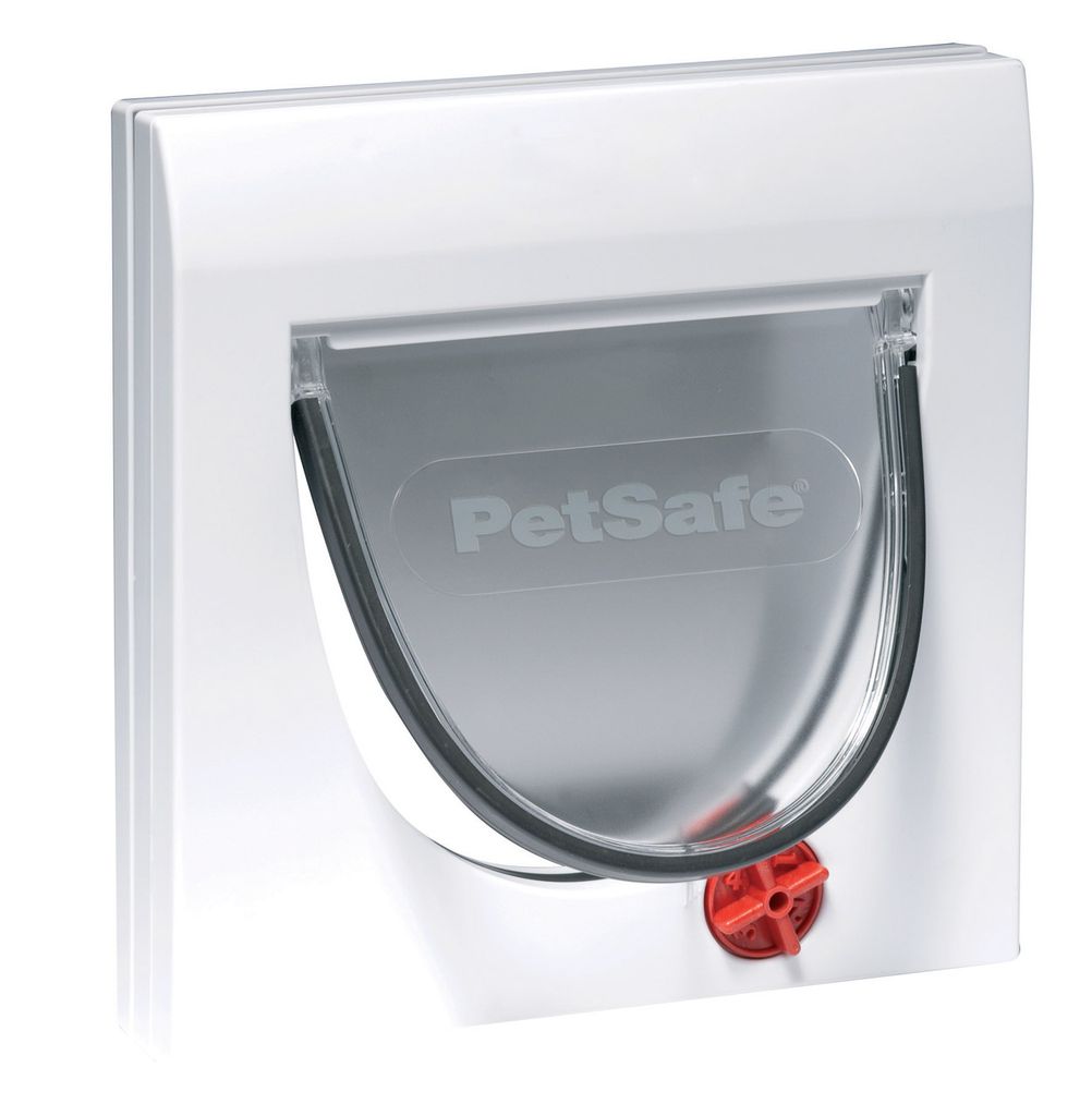 A white PetSafe cat flap with a transparent flap and a red locking mechanism.