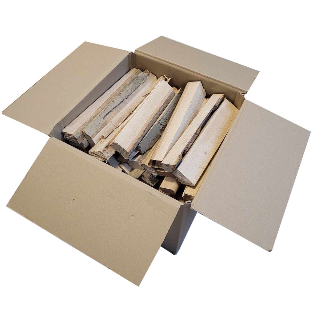 A cardboard box filled with pieces of firewood.