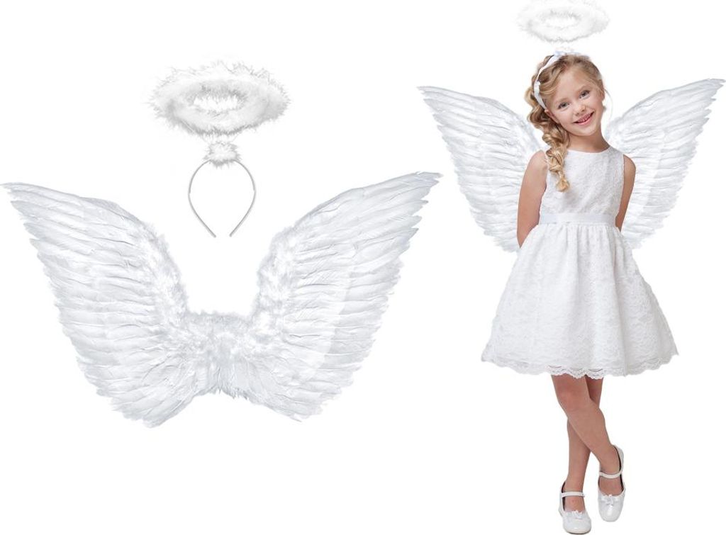 A young girl dressed as an angel, wearing a white dress, wings, and halo, posing for a photo. Beside her are the angel wings and halo set.