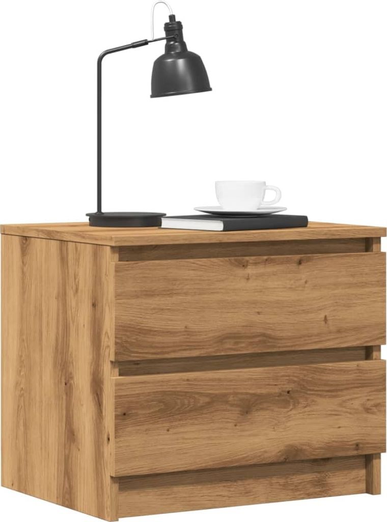 A wooden nightstand with two drawers, a black desk lamp, a book, and a cup of coffee on top.