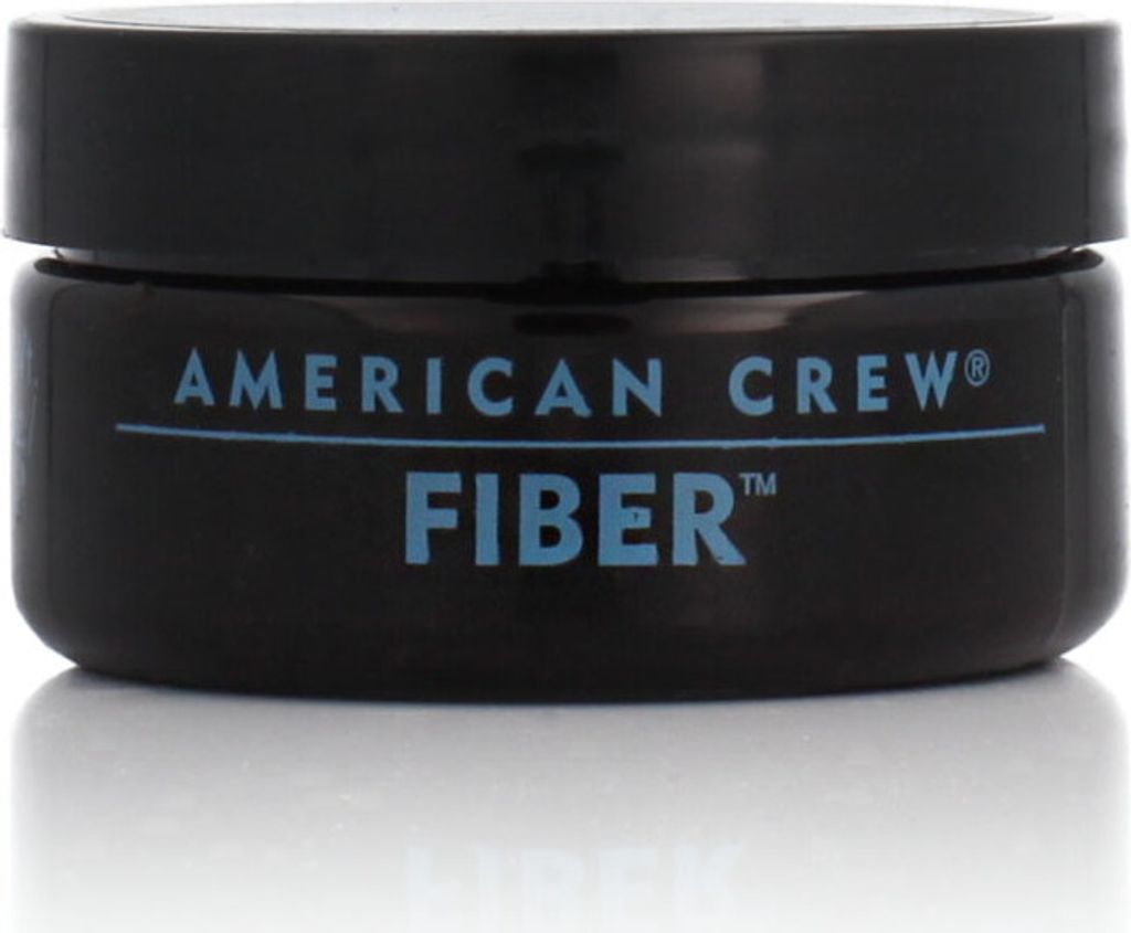 A black jar of American Crew Fiber hair product is shown against a white background.