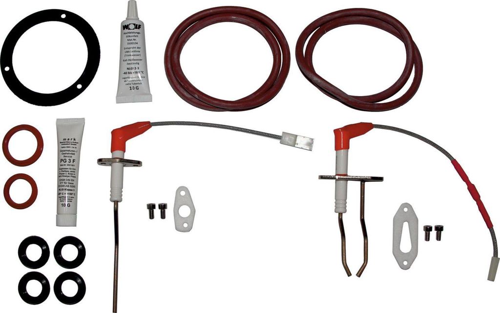 A kit of spare parts for a gas appliance, laid out on a white background.