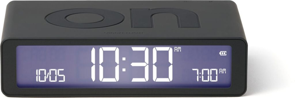 A black digital alarm clock with a digital display showing the time and alarm settings.