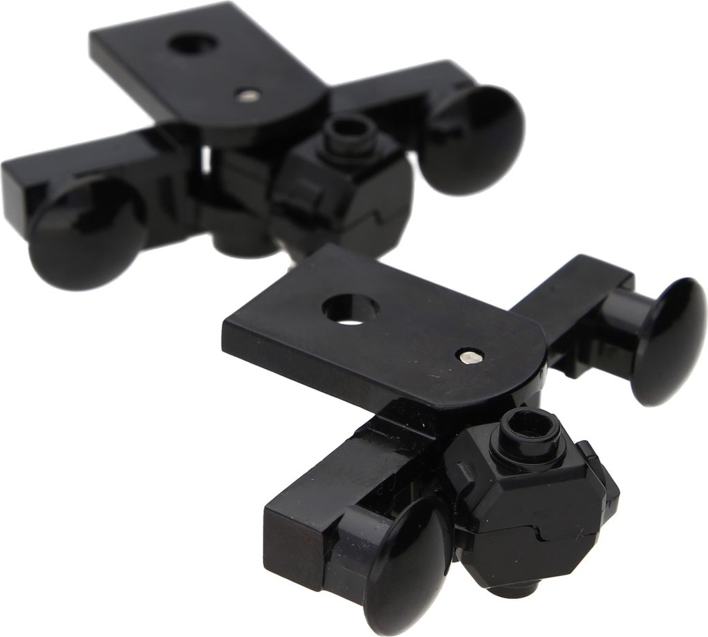 Two black LEGO magnetic couplings are shown against a white background.