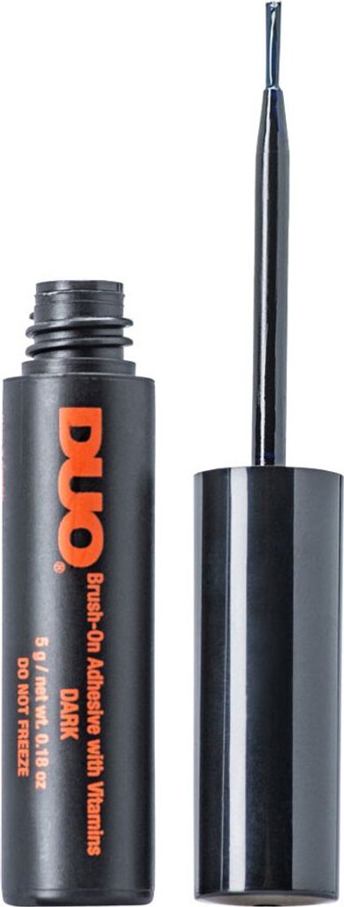 A bottle of DUO Brush-On Adhesive with Vitamins, Dark Tone, with its applicator brush.