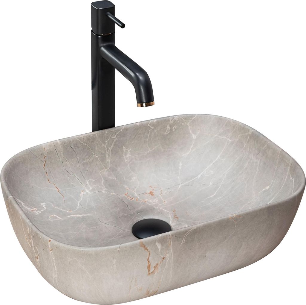 A beige oval countertop sink with a black faucet.