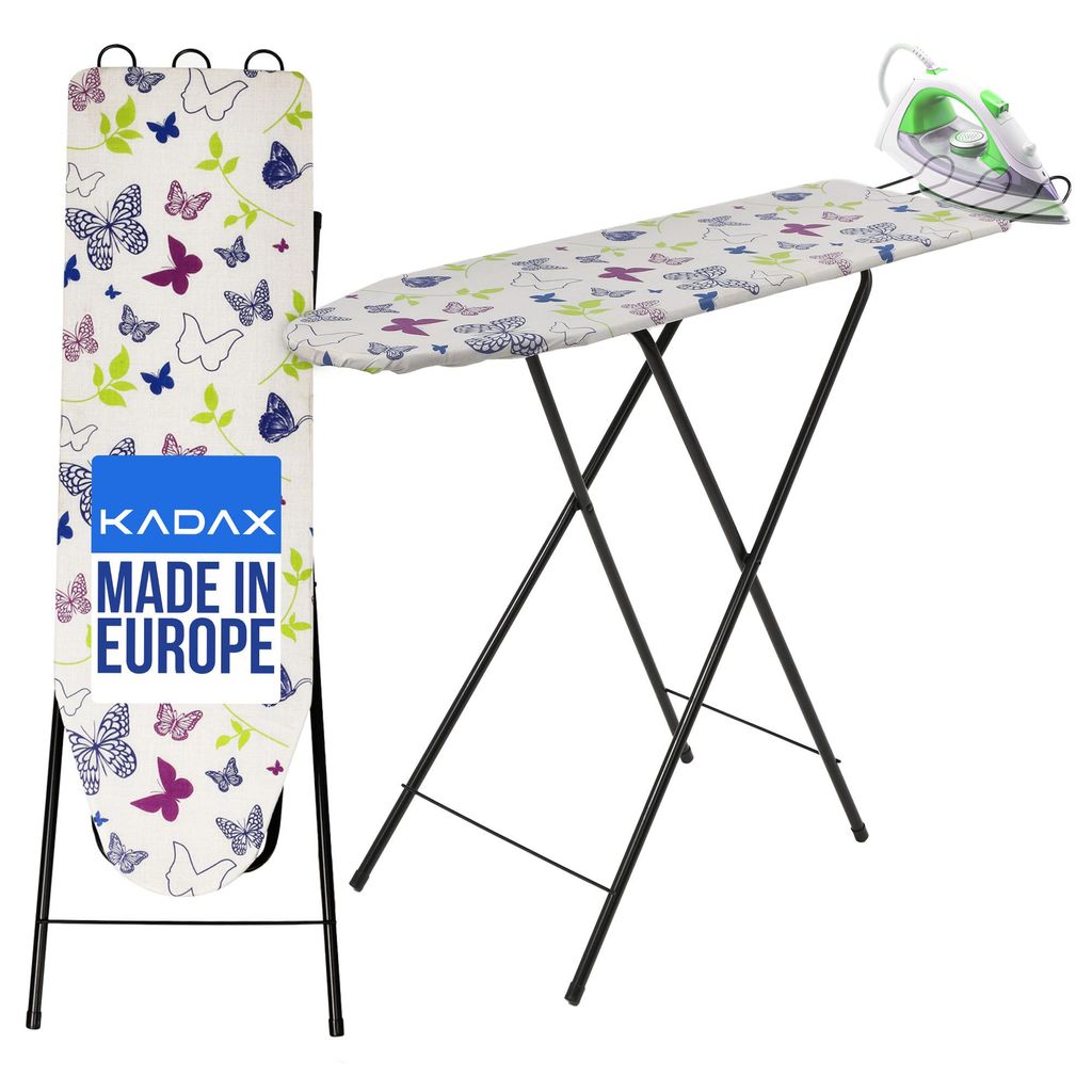 An ironing board with a butterfly pattern and an iron on top, shown in a studio setting.