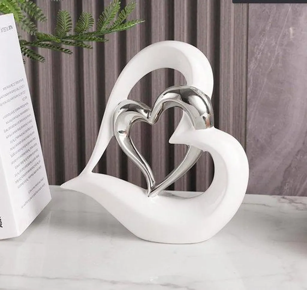 Sublimez votre intérieur avec cet ornement double cœur chic et stable