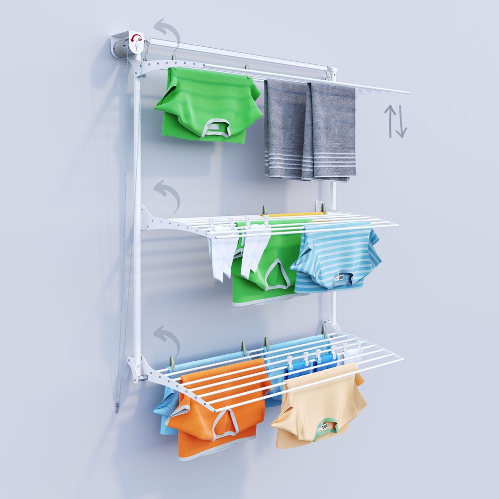 A white wall-mounted drying rack with clothes hanging on it.