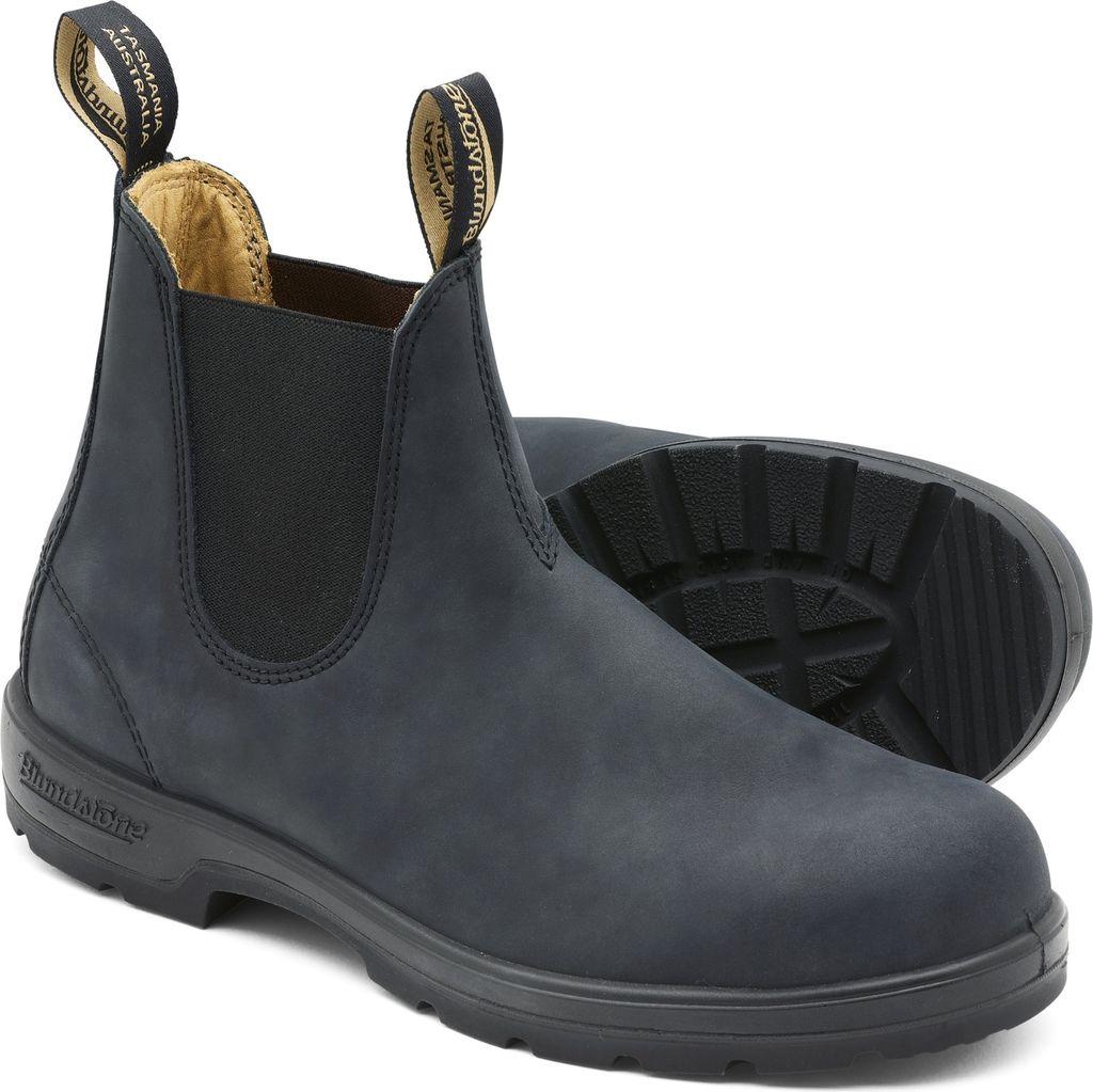 A pair of black Blundstone boots on a white background.