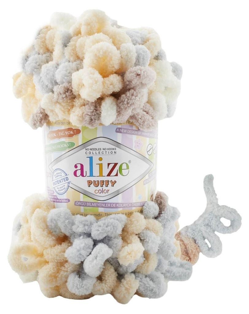 A ball of Alize Puffy Color yarn is shown, partially wrapped around its cylindrical packaging.
