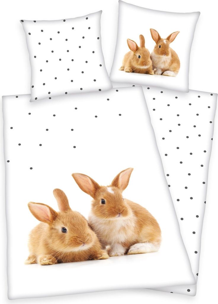A bedding set with a polka dot pattern and images of rabbits.