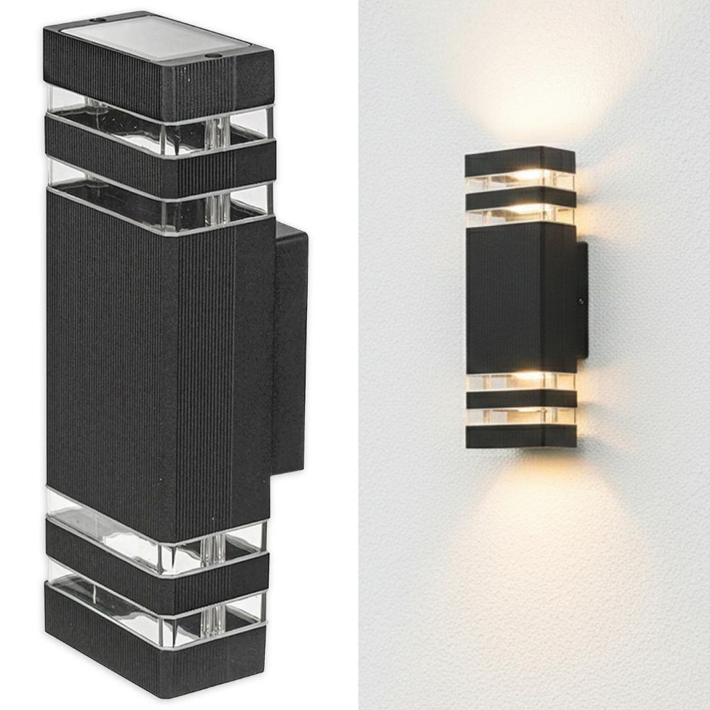 A product shot of a black outdoor wall light with clear glass accents, shown against a white background. To the right, the same light is shown mounted on a white wall, illuminating upwards and downwards.