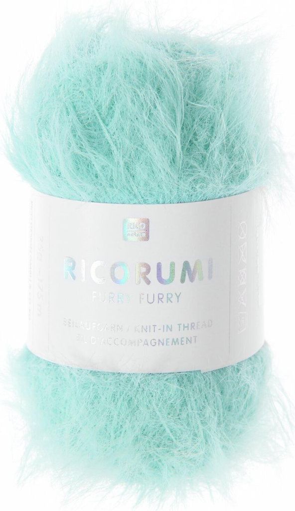 A ball of fluffy turquoise yarn with a label.