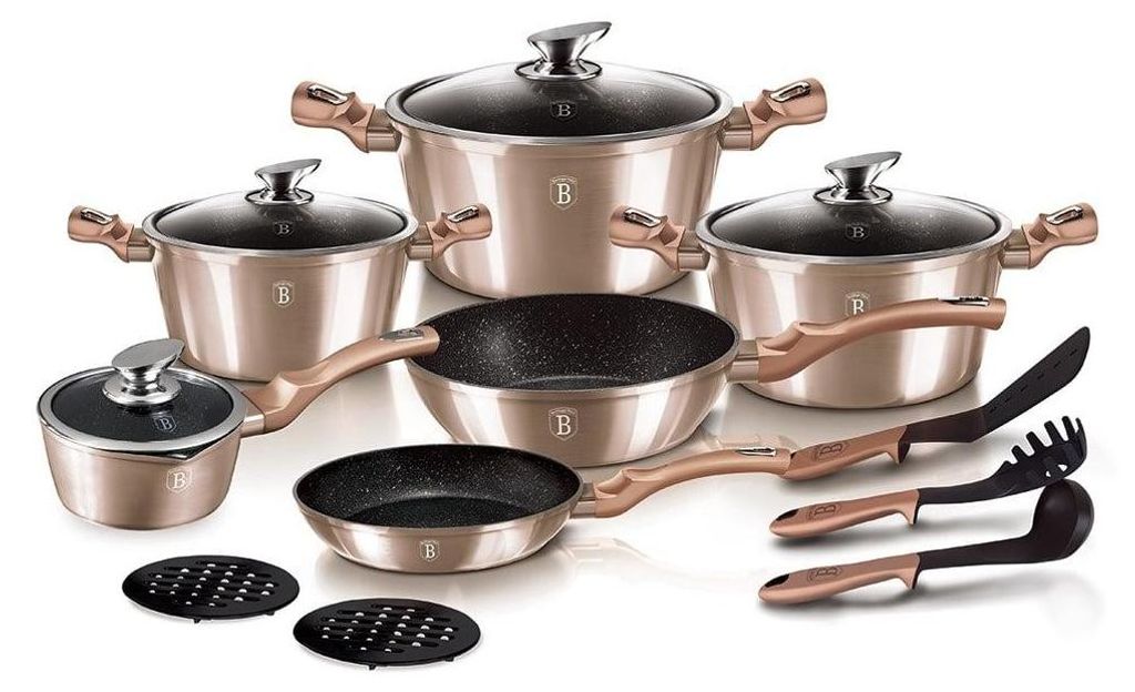 A collection of cookware and kitchen utensils arranged on a white background.