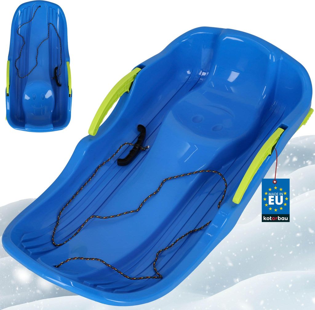 A blue plastic sled with green handles and a rope, shown on a snowy background.