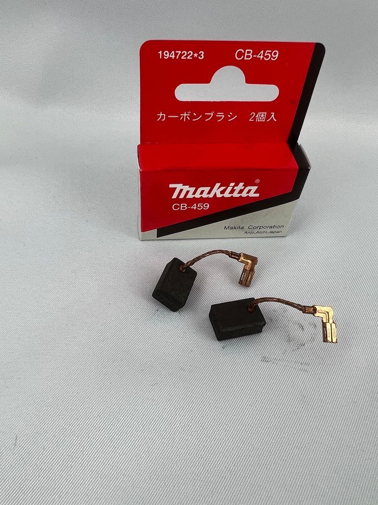 A product shot of two carbon brushes and their packaging.