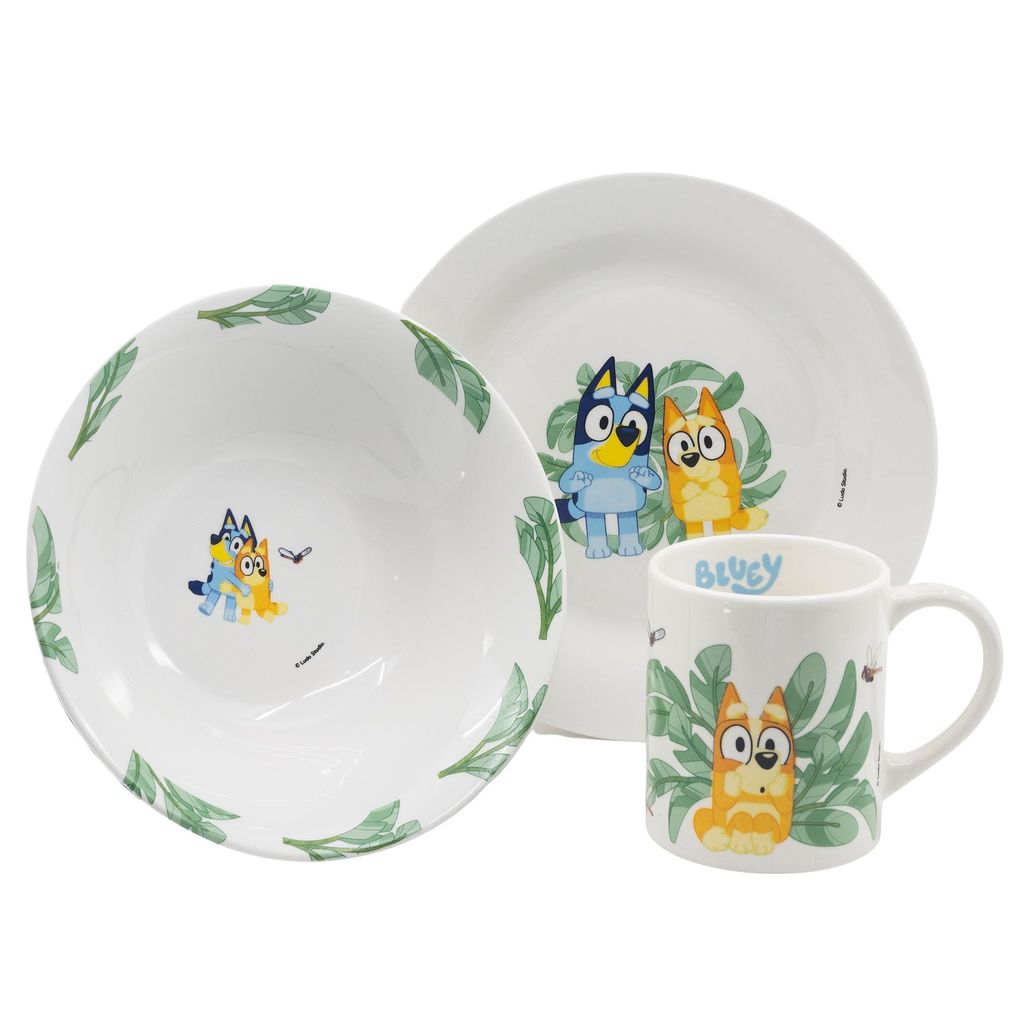 A set of children's ceramic tableware featuring Bluey characters and leaf motifs, presented on a white background.
