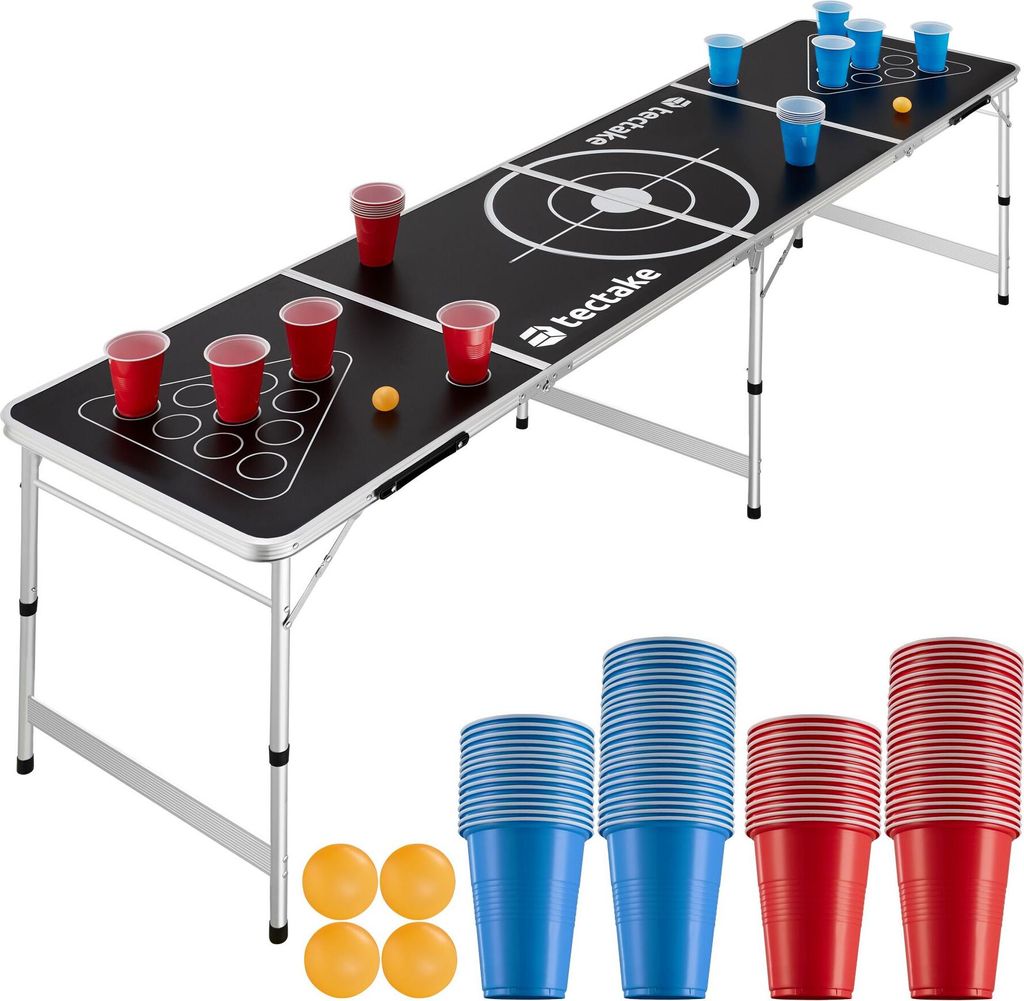 A beer pong table set up with cups and balls, with additional cups and balls displayed below.