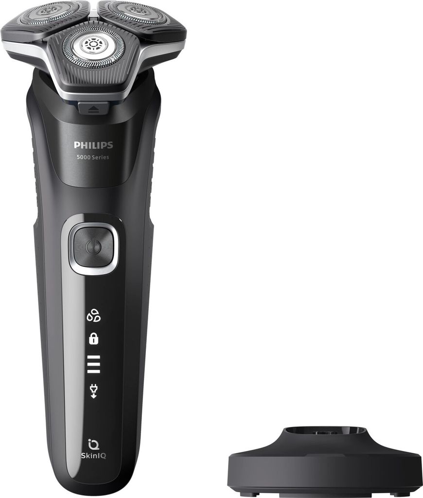 A black electric shaver with a silver shaving head and a black charging stand.