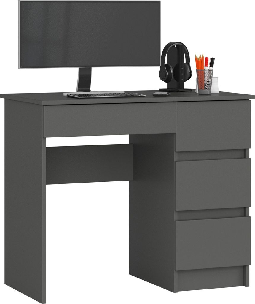 A dark gray computer desk with a monitor, headphones, and pens on top.