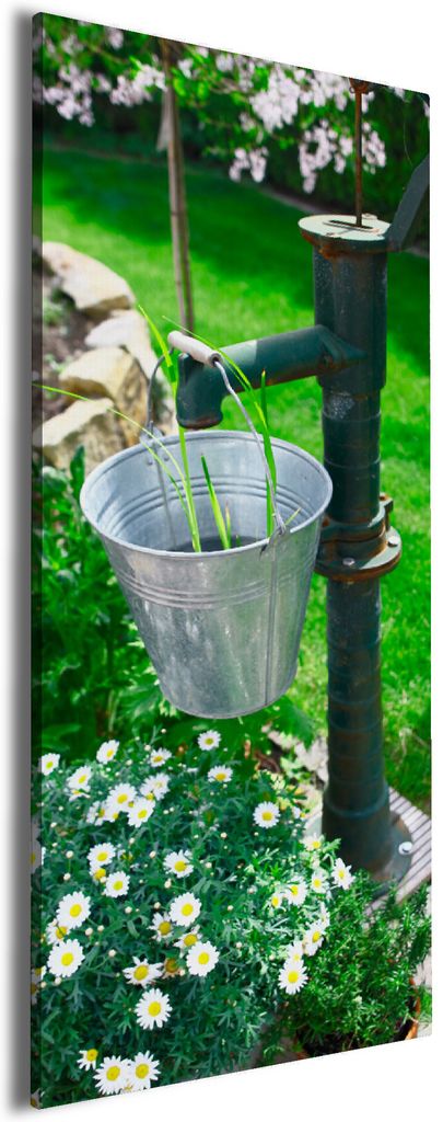 Wallario Premium Leinwandbild Wasserquelle im Garten in Größe 50 x 125 cm