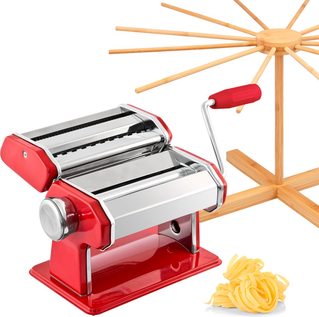 A red and silver pasta maker with a wooden pasta drying rack and a pile of fresh pasta on a white background.