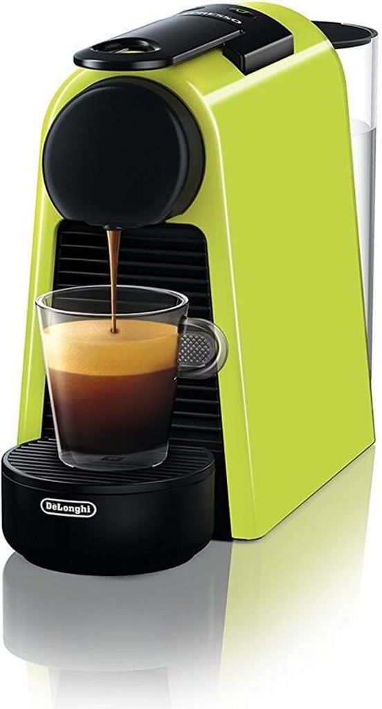 A close-up shot of a lime green Nespresso coffee machine brewing espresso into a glass cup.