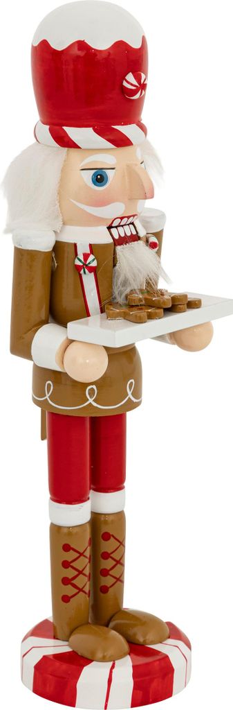 A nutcracker figure dressed as a gingerbread man, holding a tray of cookies.