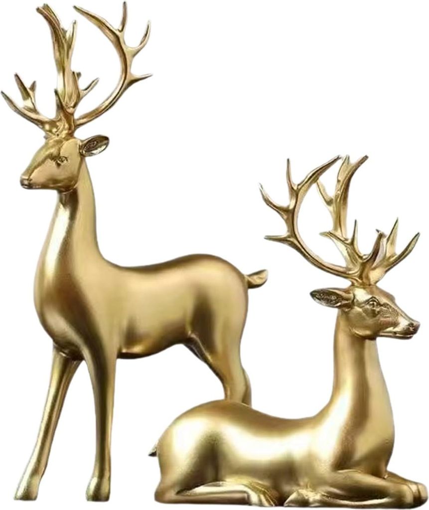 Two golden deer figurines, one standing and one lying down, against a white background.