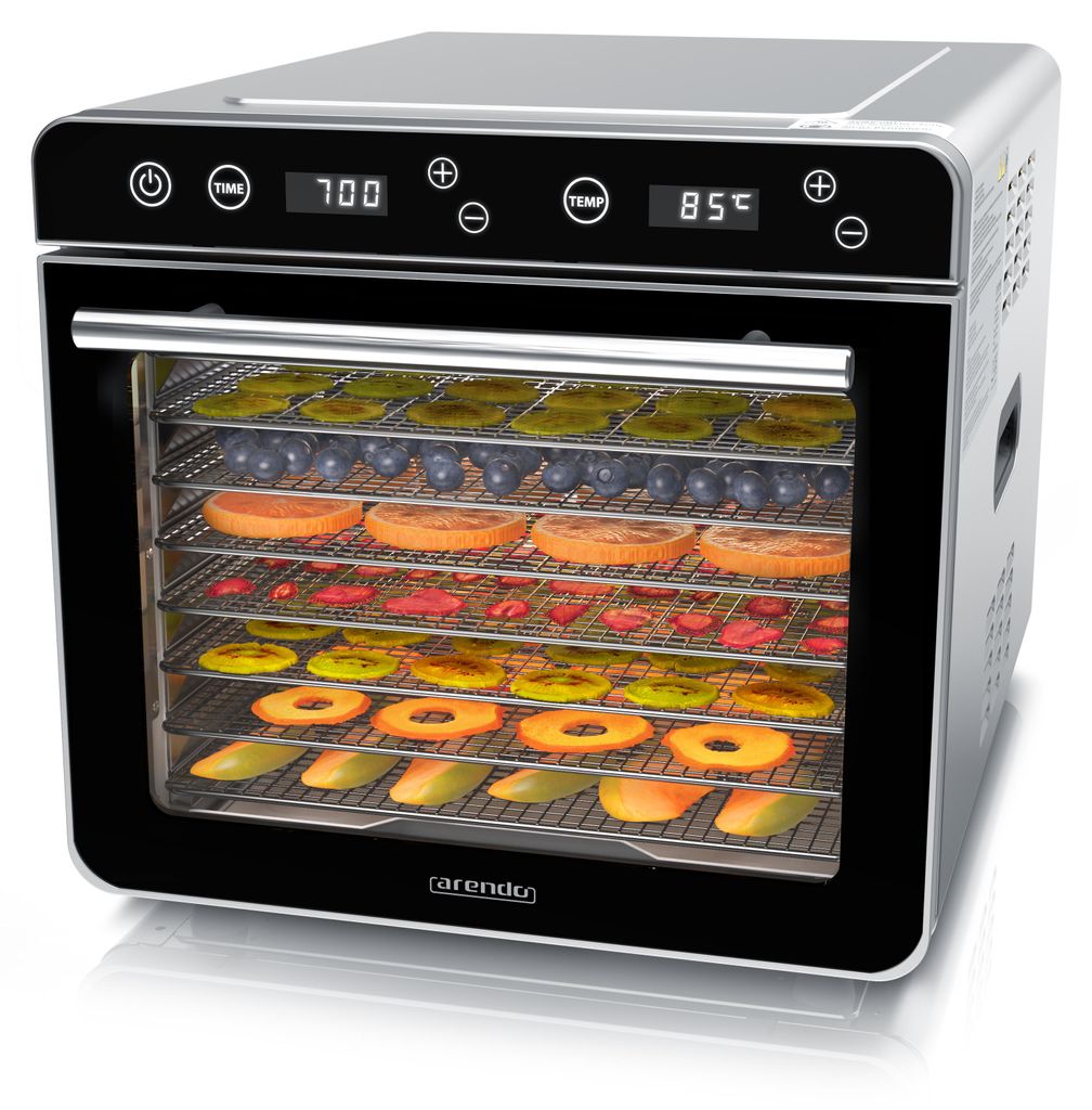 A food dehydrator filled with various fruits and vegetables.