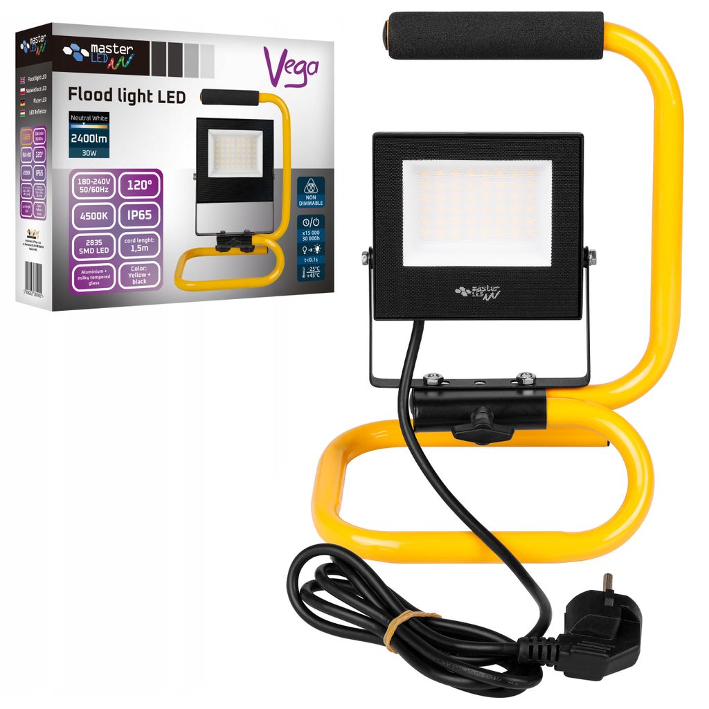 A floodlight LED on a yellow stand, next to its packaging.