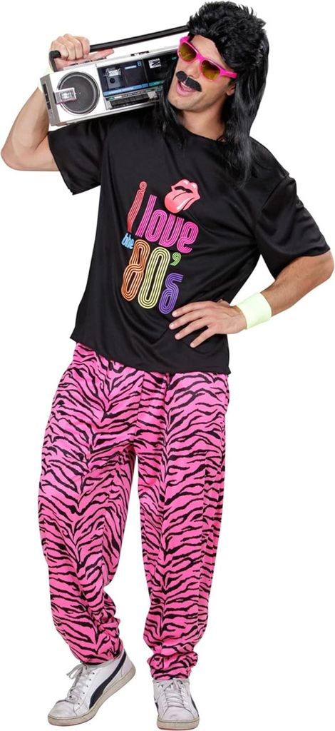A man wearing an 80s-themed costume, including a black t-shirt with "I love 80's" graphic and pink tiger-striped pants, holding a boombox over his shoulder.