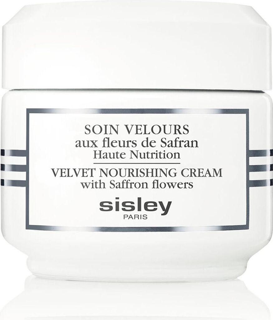 A white jar of Sisley Velvet Nourishing Cream with Saffron flowers.