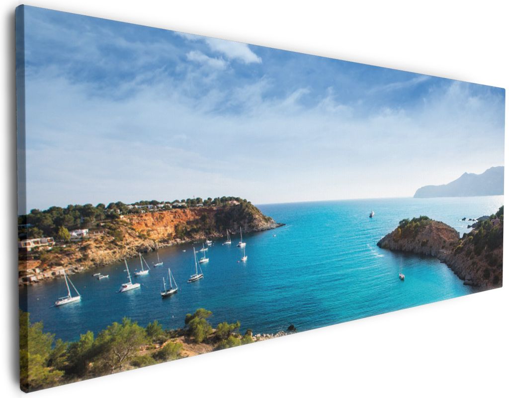 Wallario Premium Leinwandbild Ibiza - Blick von einer Bucht aufs Meer in Größe 80 x 200 cm
