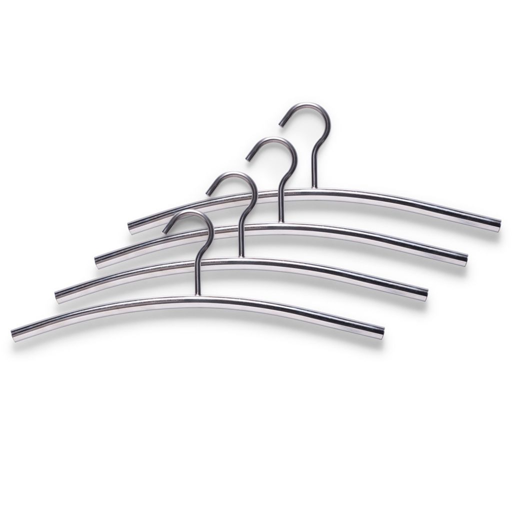 A set of four metal hangers arranged diagonally on a white background.